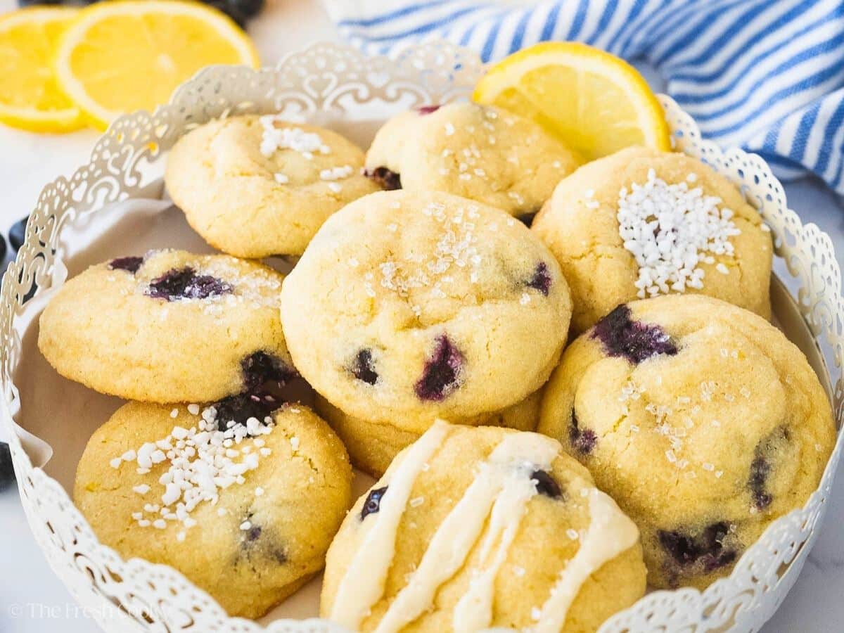 Lemon blueberry cookies stacked and layered in pretty decorative serving platter.