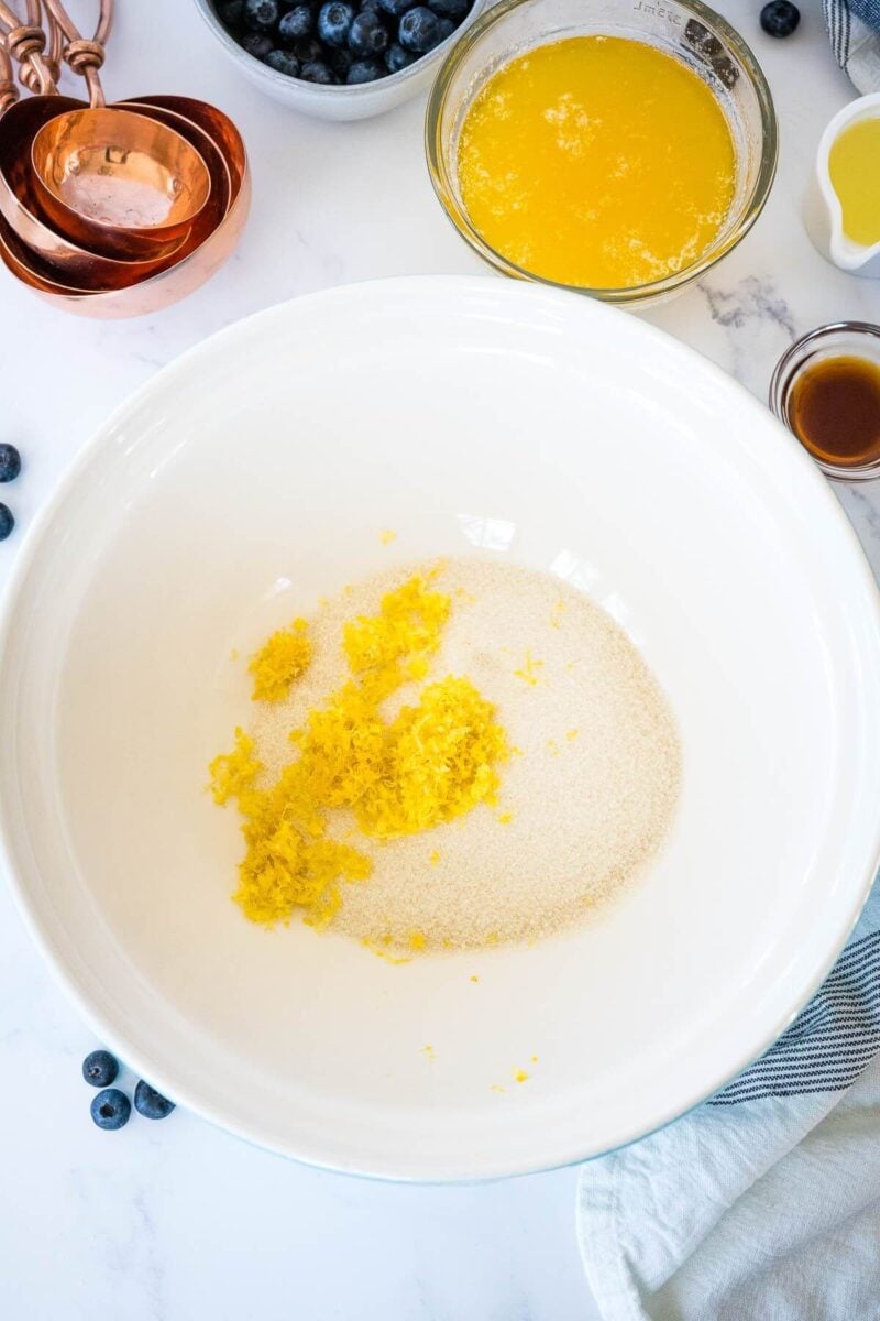 Sugar and lemon zest in a large bowl.