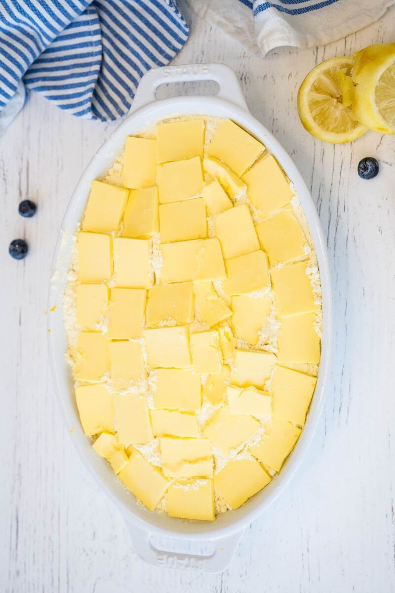 The whole baking dish is covered with square butter slices.