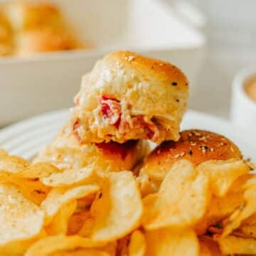 Reuben Sliders on plate with barbecue potato chips.