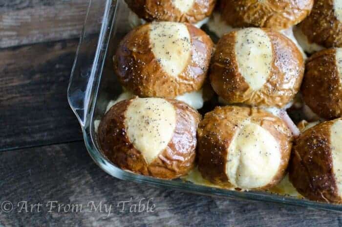 Ham and cheese sliders made with pretzel rolls.