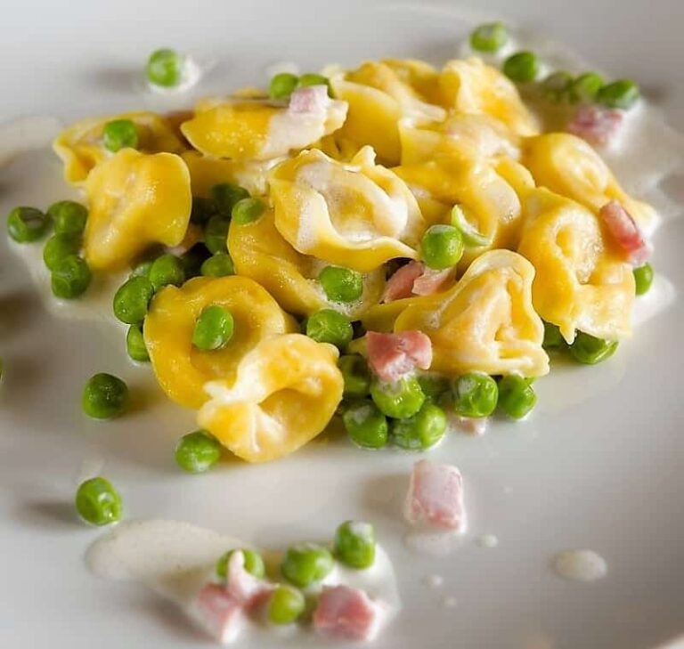 Easy ham and cheese tortellini serving on a plate.
