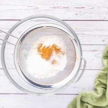 A sift with powdery ingredients lets them through into the bowl.