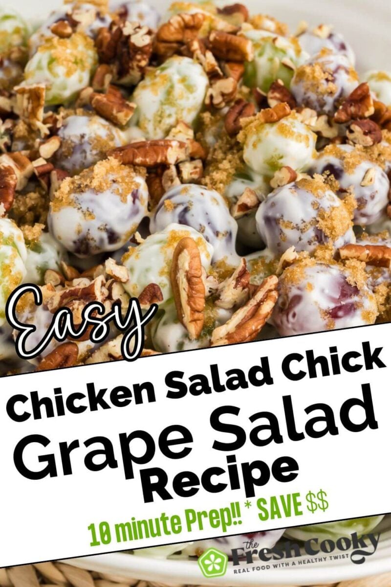 A close up of salad shows grapes coated in dressing and garnished with pecans and seasonings, to pin.