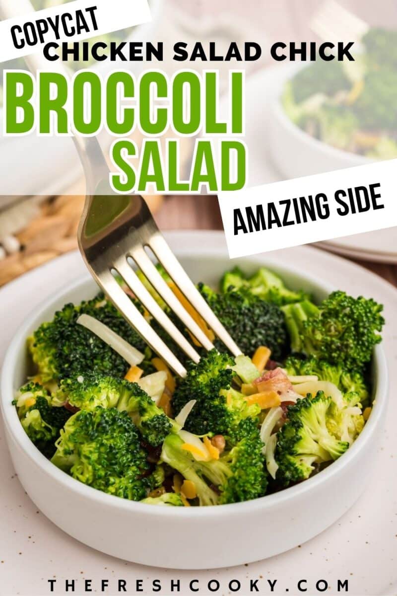 A copycat Chicken Salad Chick broccoli salad in a white bowl with a fork stabbing a crunchy bite, to pin.