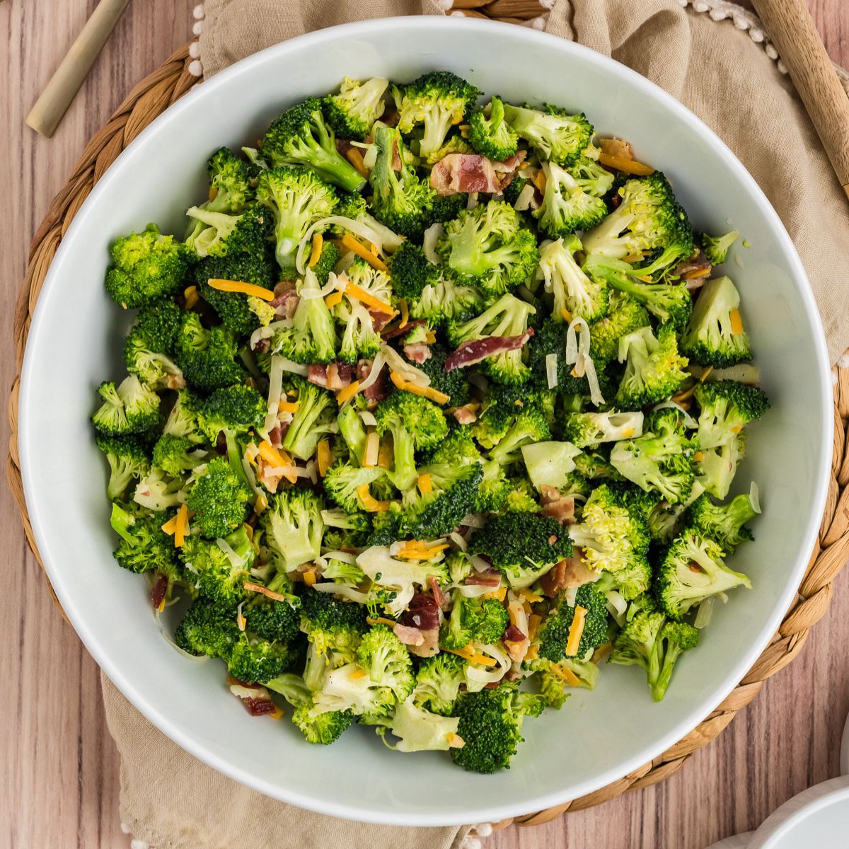 Broccoli salad in large bowl, topped with crisp bacon!