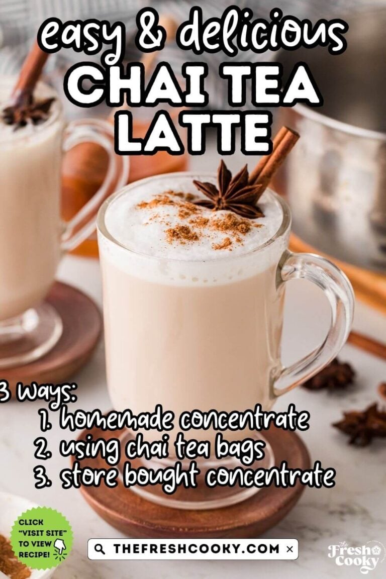 Glass mug filled with a chai tea latte, topped with frothed milk and a sprinkle of cinnamon, star anise and a cinnamon stick, with another mug in the background, for pinning.