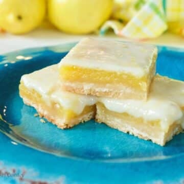 Three lemon squares with gooey glaze.