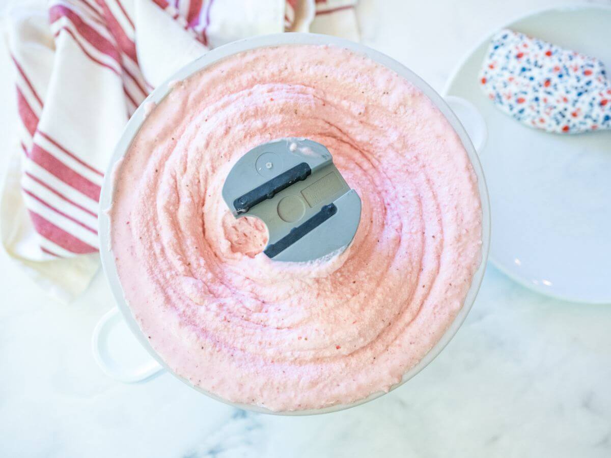 Beautifully churned strawberry ice cream in KitchenAid Ice Cream Attachment. 