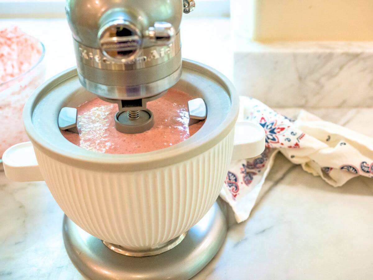 Strawberry ice cream in KitchenAid Ice Cream maker just starting to churn.