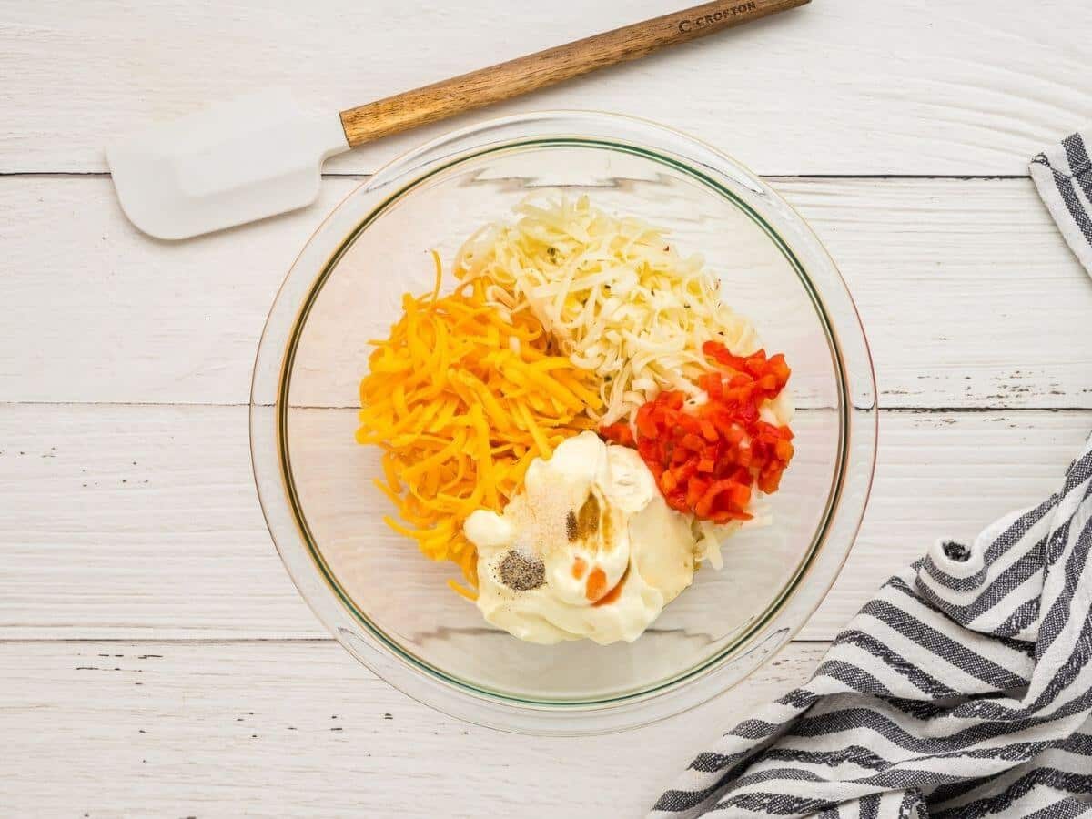 Ingredients for pimento cheese in a mixing bowl.