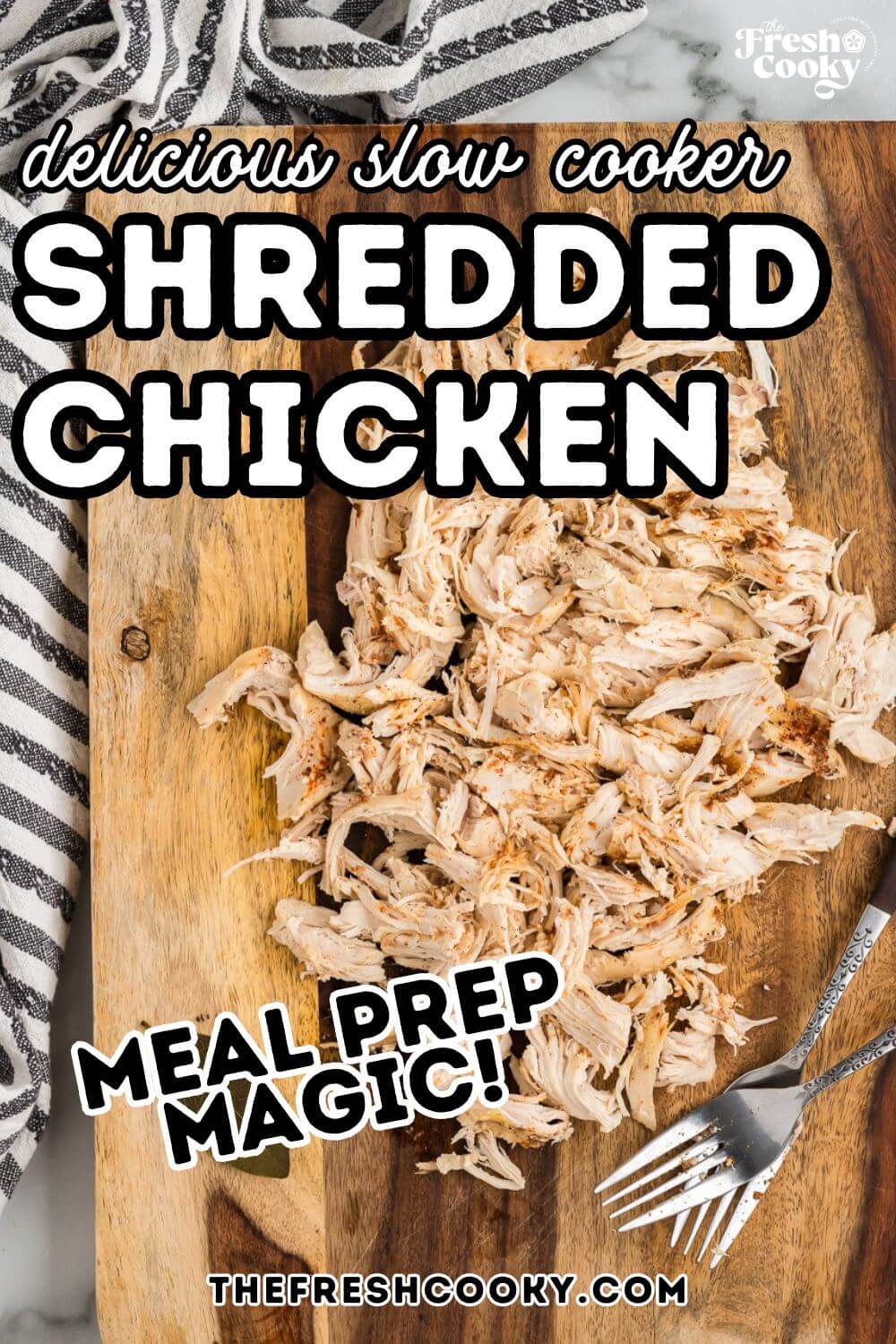Shredded chicken on a cutting board, to pin. 