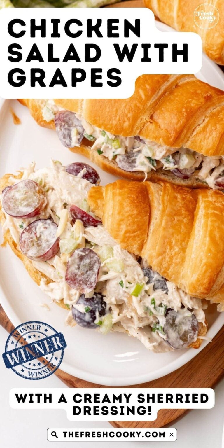 Chicken salad with grapes in a croissant on a plate, to pin.