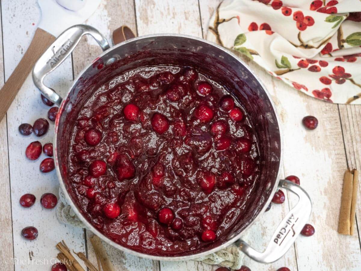 Cranberry sauce in a large silver pot.