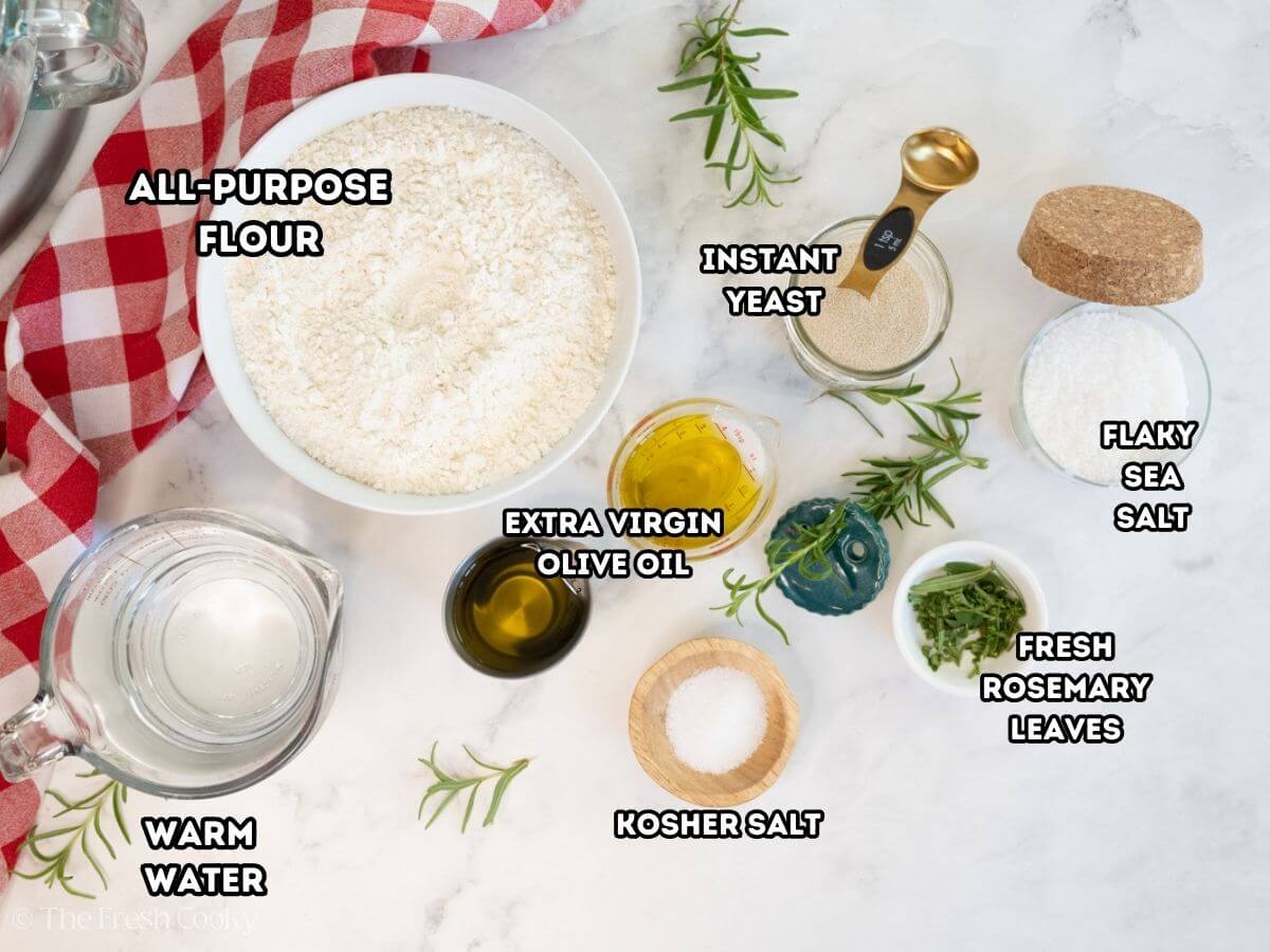Ingredients needed for focaccia bread on a kitchen counter.