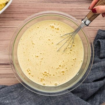 Mix together eggs, cream, milk and spices in a large bowl.