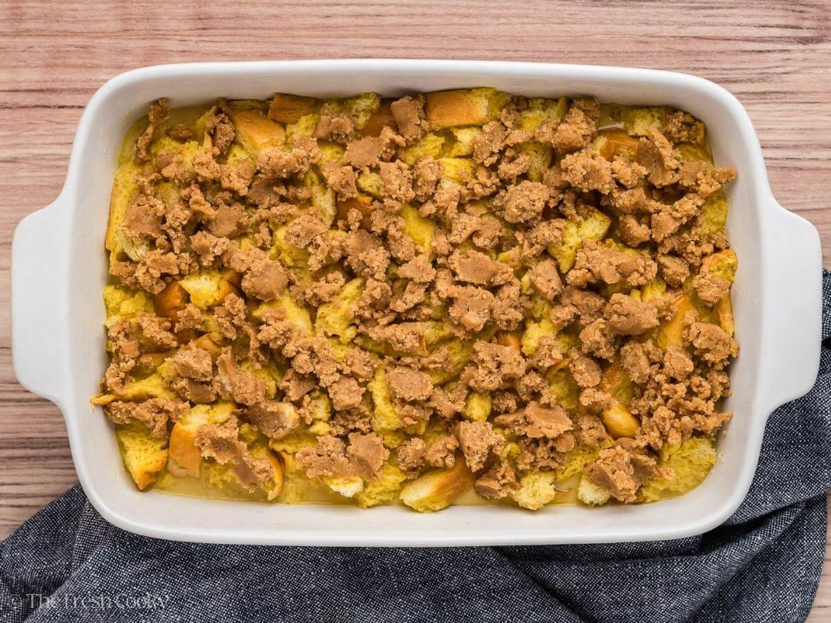 Casserole with streusel topping scattered evenly over the top. 