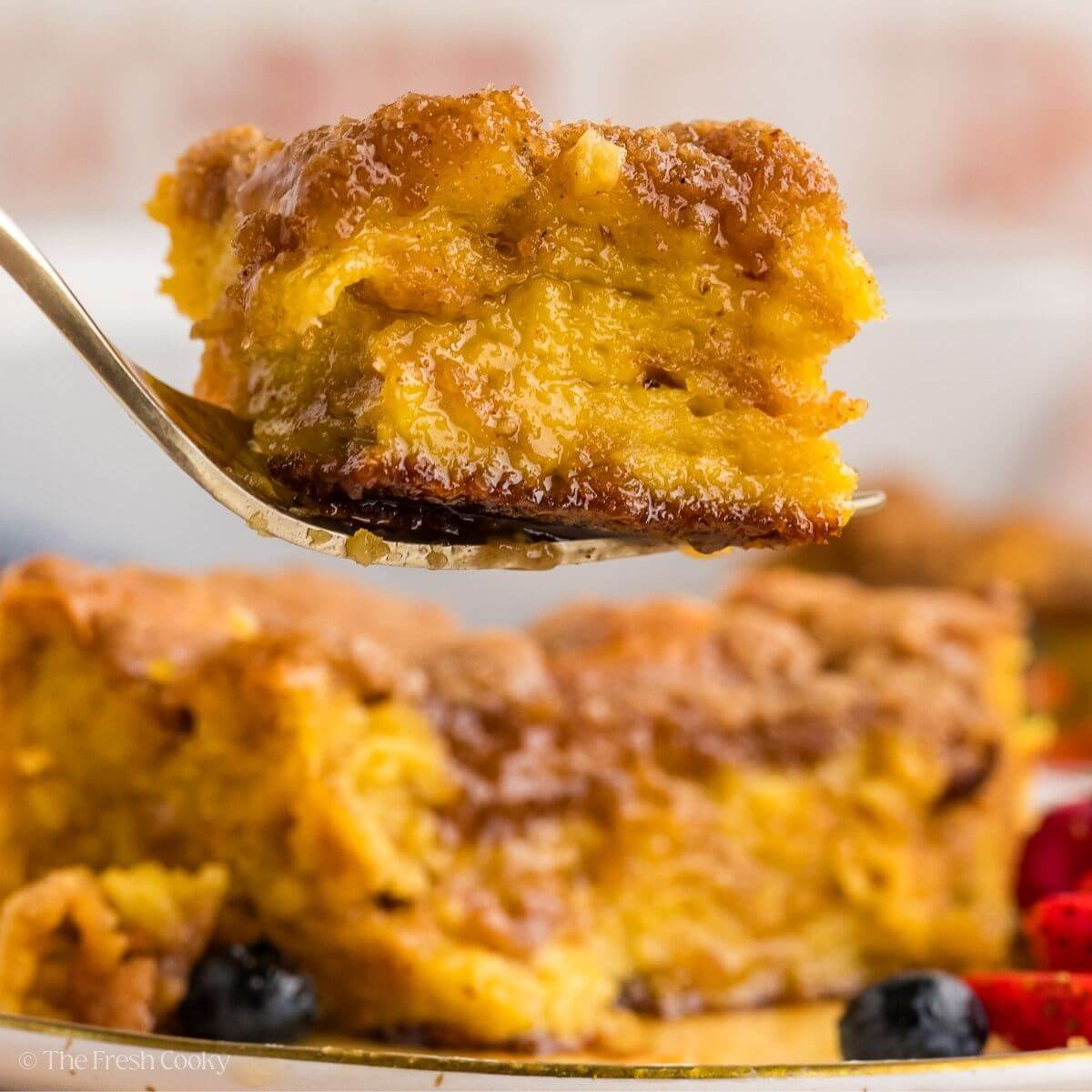 Slice of French toast casserole being served.