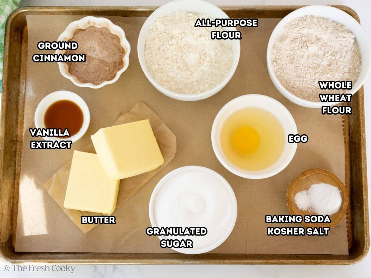 Ingredients needed for snickerdoodle cookies on a sheet pan.