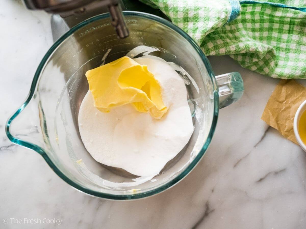Butter and sugar in the bowl of a stand mixer.