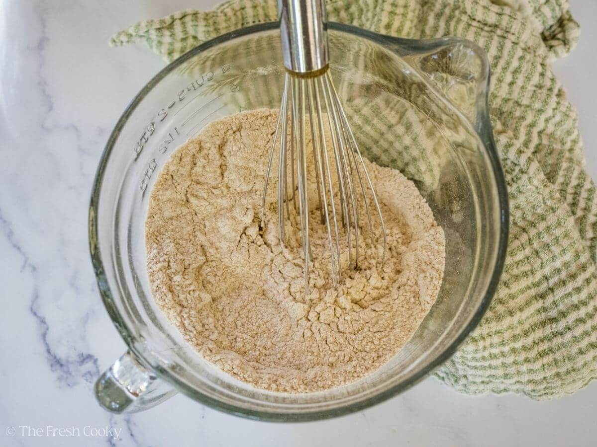 Dry ingredients needed for snickerdoodles being whisked together.