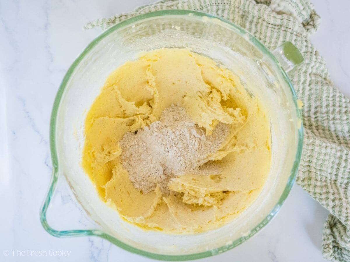 Butter and sugar creamed together in a stand mixer bowl with some flour added.