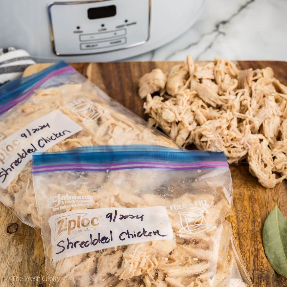 Shredded chicken in labeled ziplock bags.