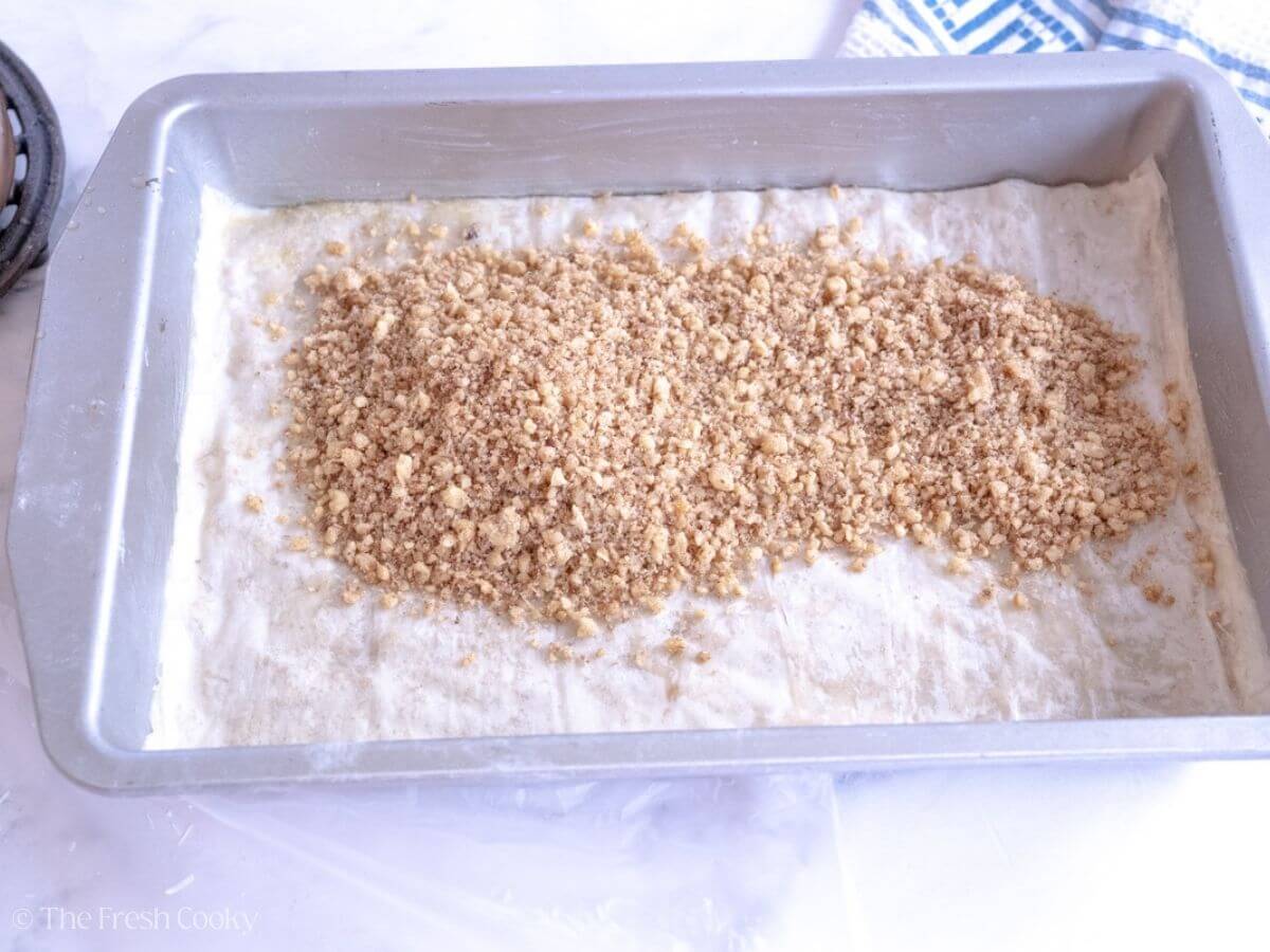 Crushed nut mixture on top of the layer of phyllo dough.