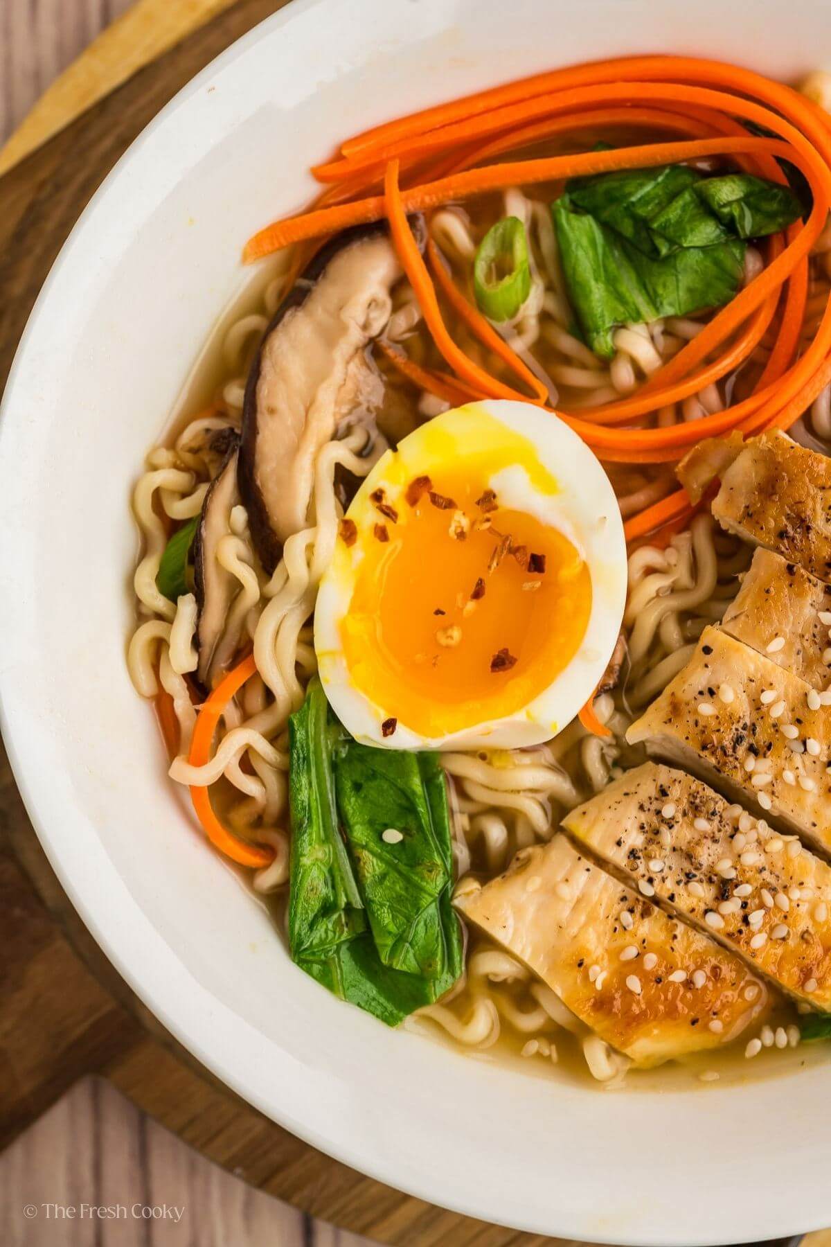 Overhead shot of homemade ramen with vegetables and chicken.