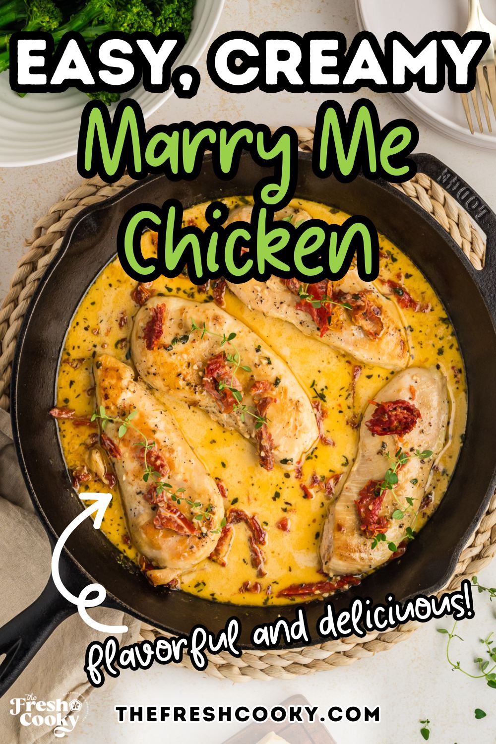 A cast iron skillet with creamy sauce and chicken breasts nestled inside, for pinning.