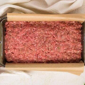 Meatloaf in the loaf pan before being baked.