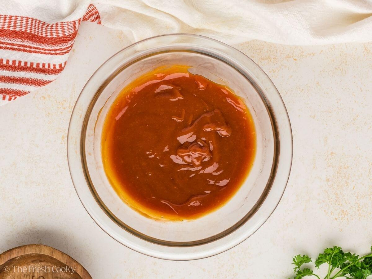 Meatloaf glaze in a small glass bowl.