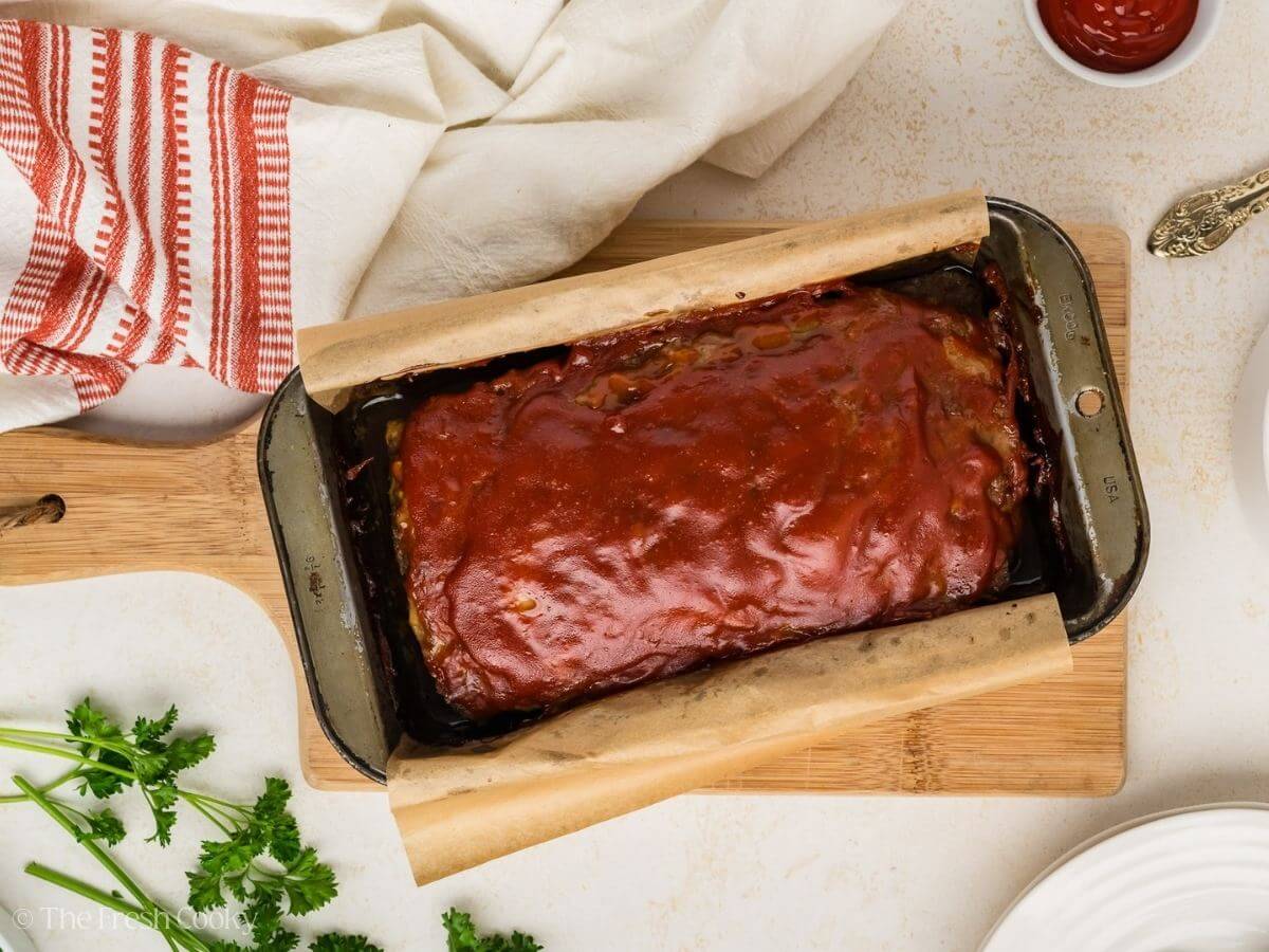 Meatloaf in the loaf pan after being baked.