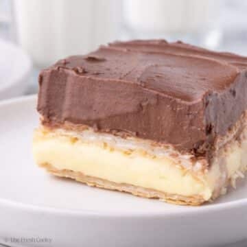 Slice of chocolate eclair cake on a plate.
