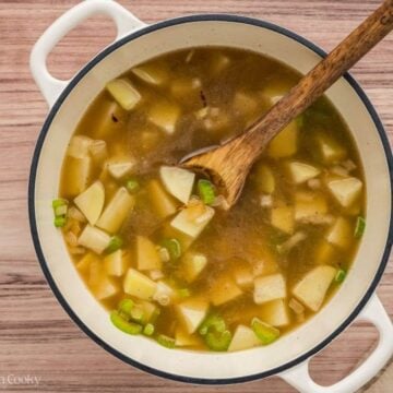Broth and diced potatoes added to the stock pot.
