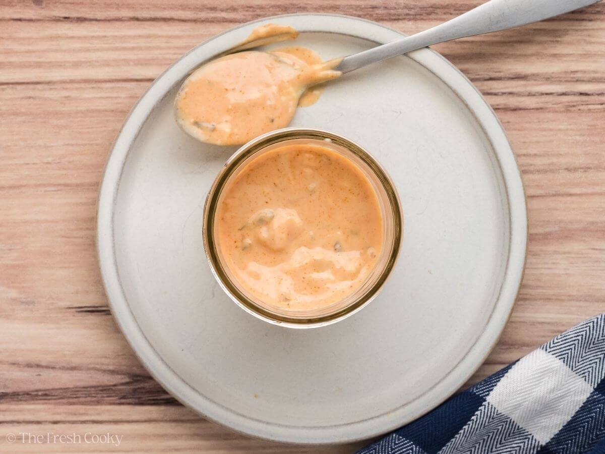 Thousand island dressing in a small glass bowl.