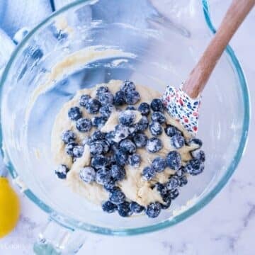 Folding blueberries into lemon batter.