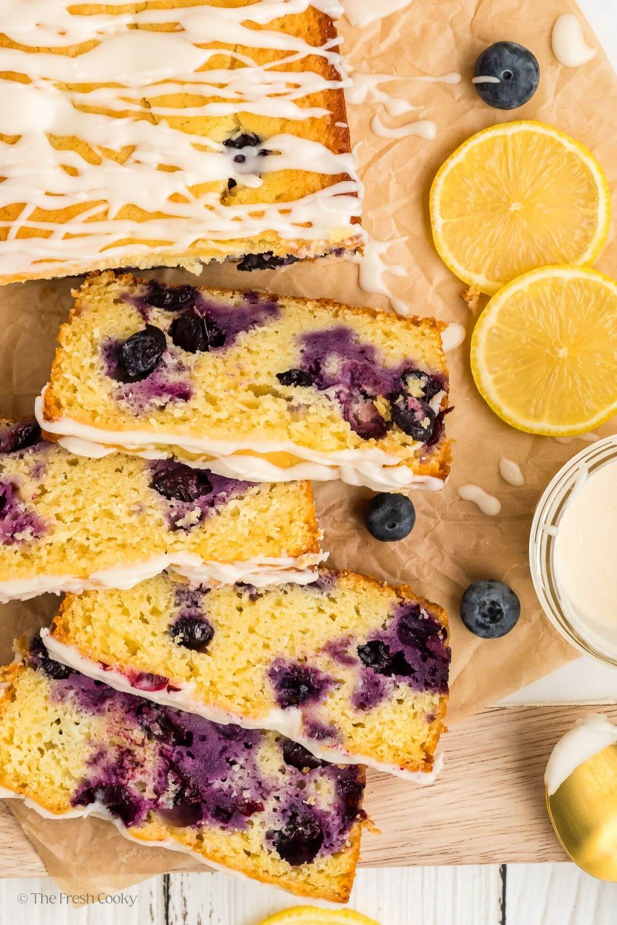 Overhead shot of lemon blueberry bread with four slices off the end.