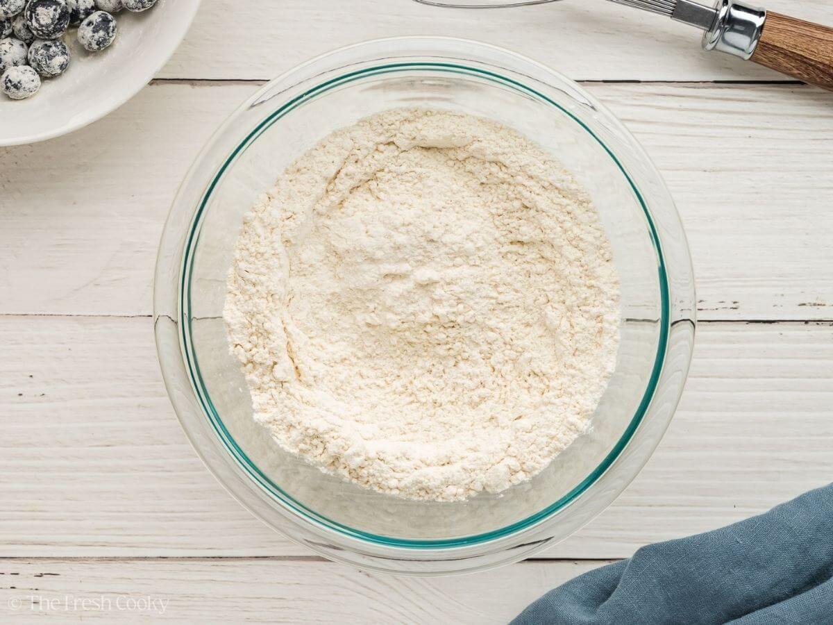Dry ingredients sifted into a glass mixing bowl.