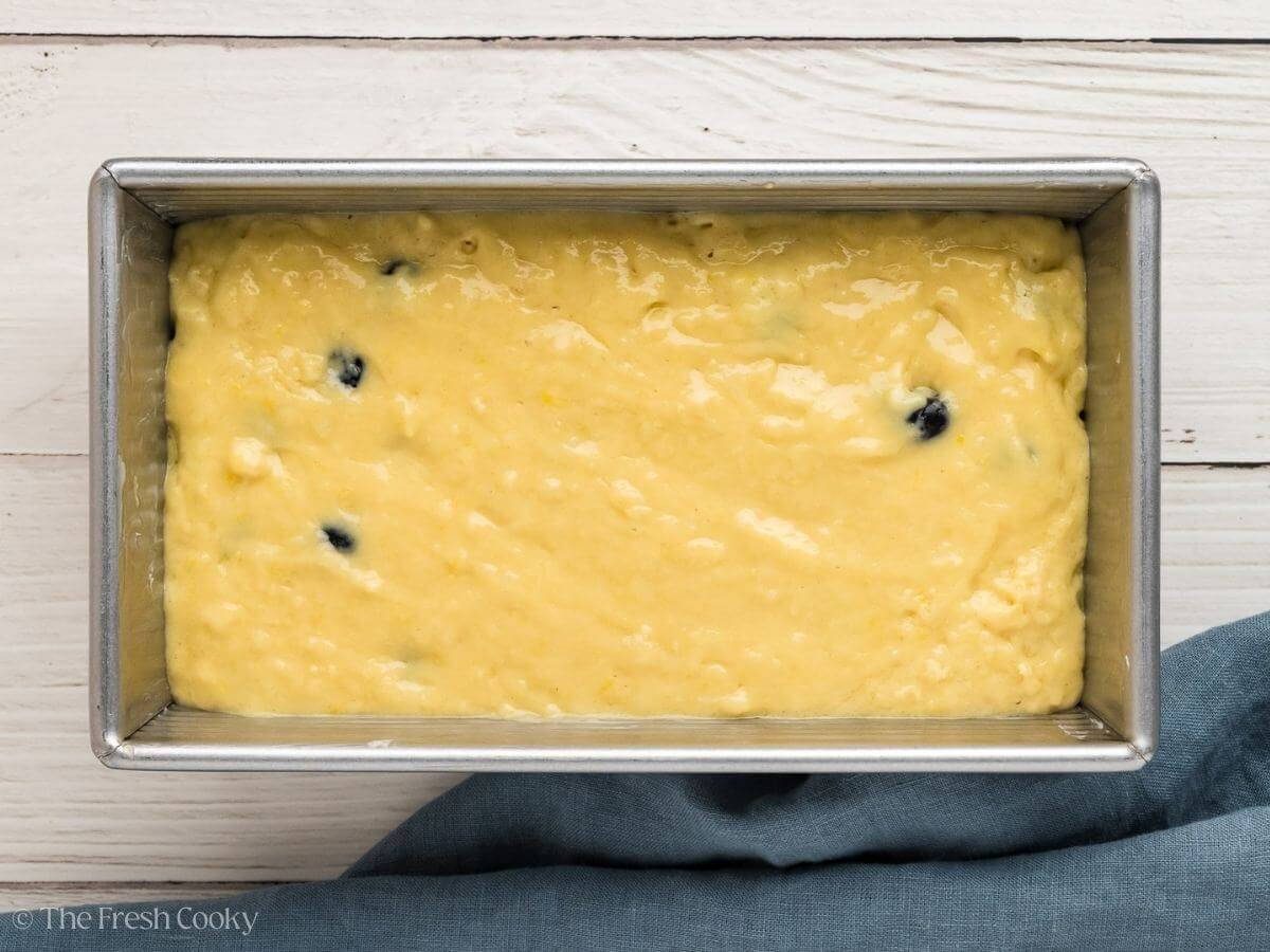 Lemon blueberry bread batter in loaf pan before baking.
