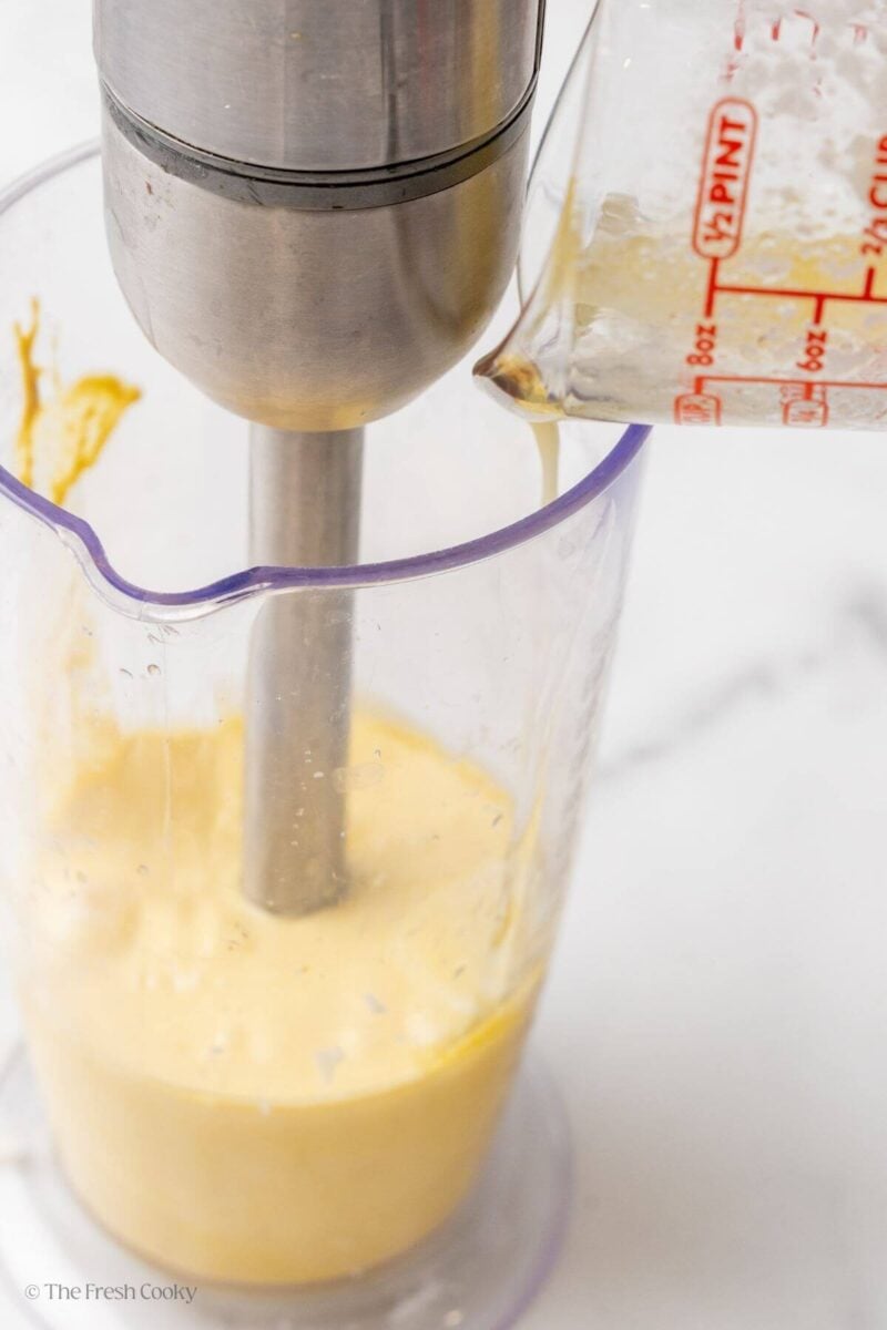 Using an immersion blender to making homemade hollandaise sauce.