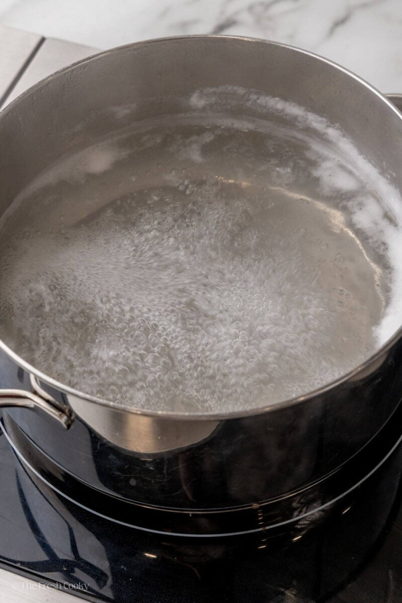 Large pot of boiling water for poaching eggs.