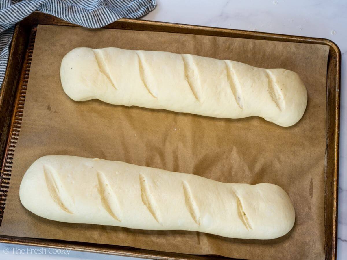 French bread loaves after rising for a second time before baking.