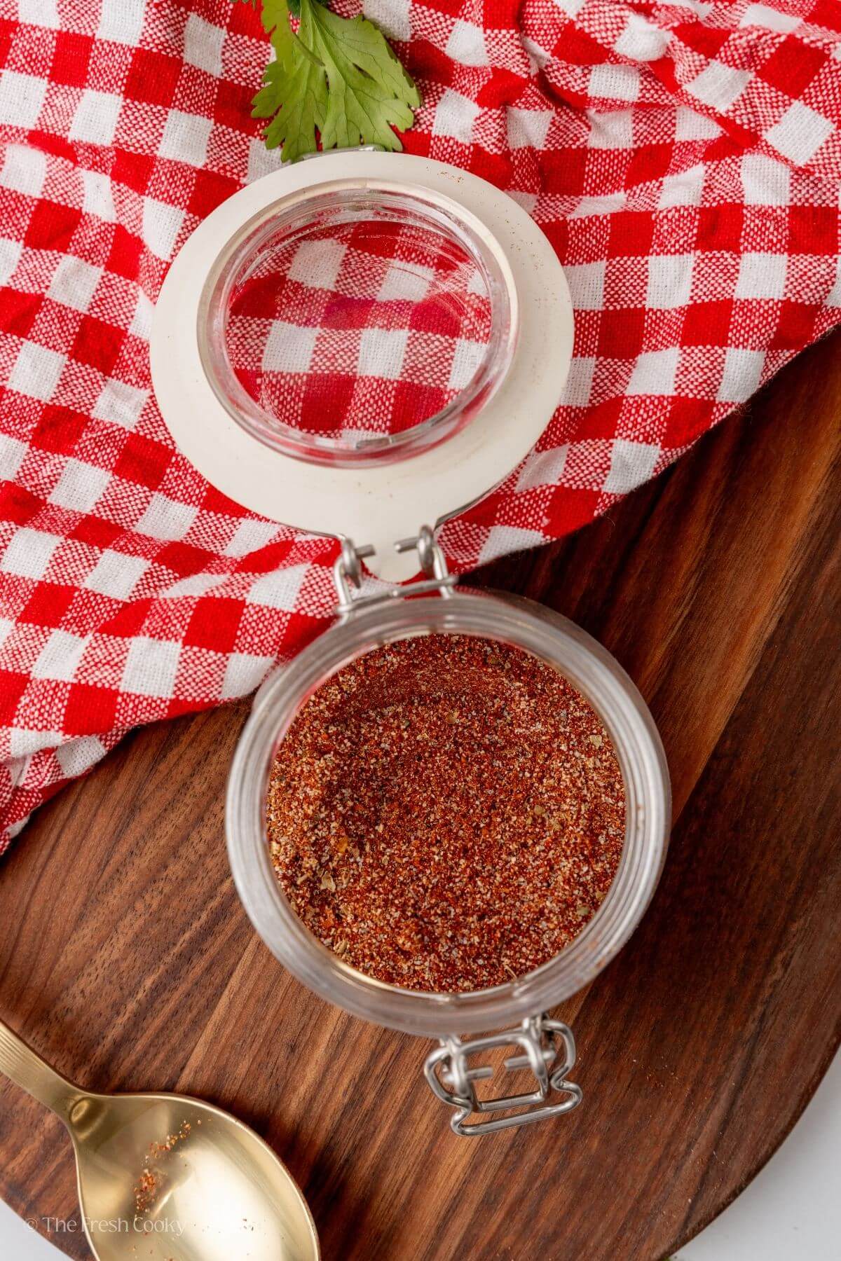 Overhead shot of homemade taco seasoning in a jar with the lid off.