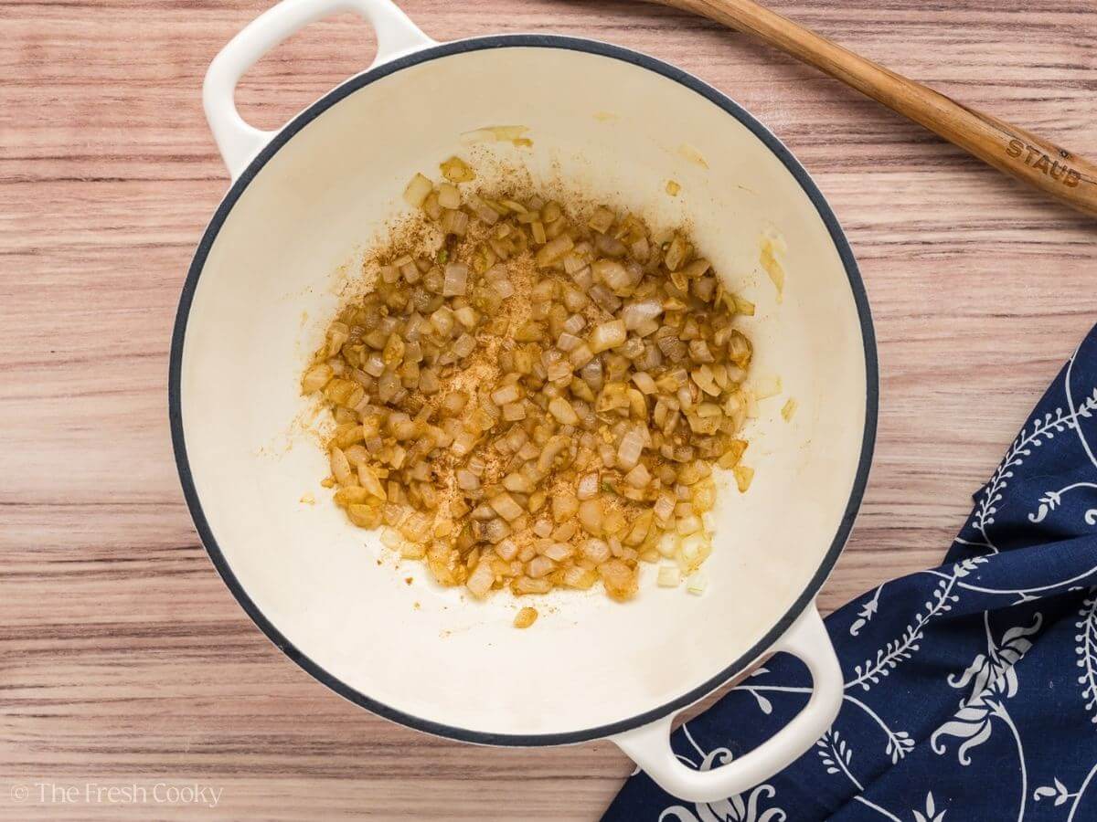 Sauteing onions and garlic in soup pot.
