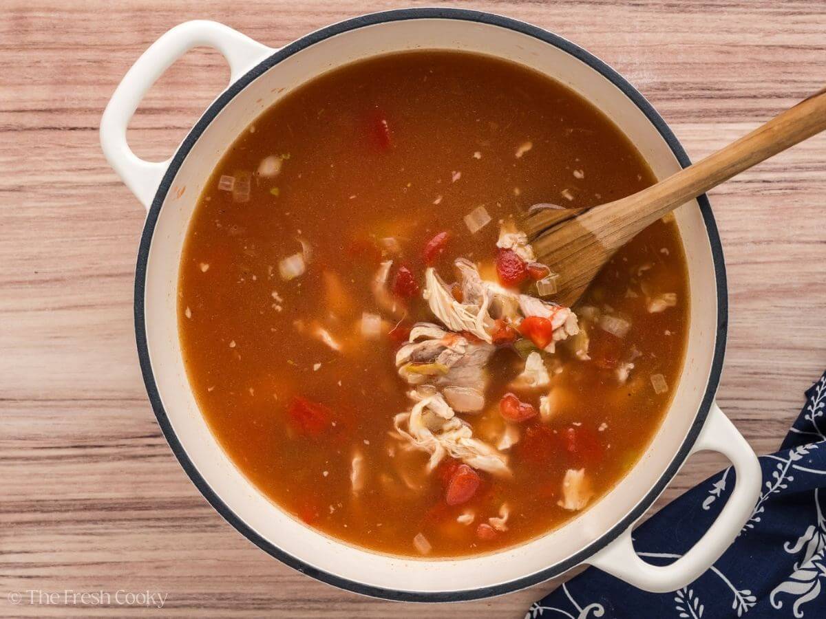 Add chicken broth, chiles, chicken and tomatoes to soup.