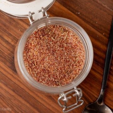 Overhead shot of steak seasoning stored in a small jar.