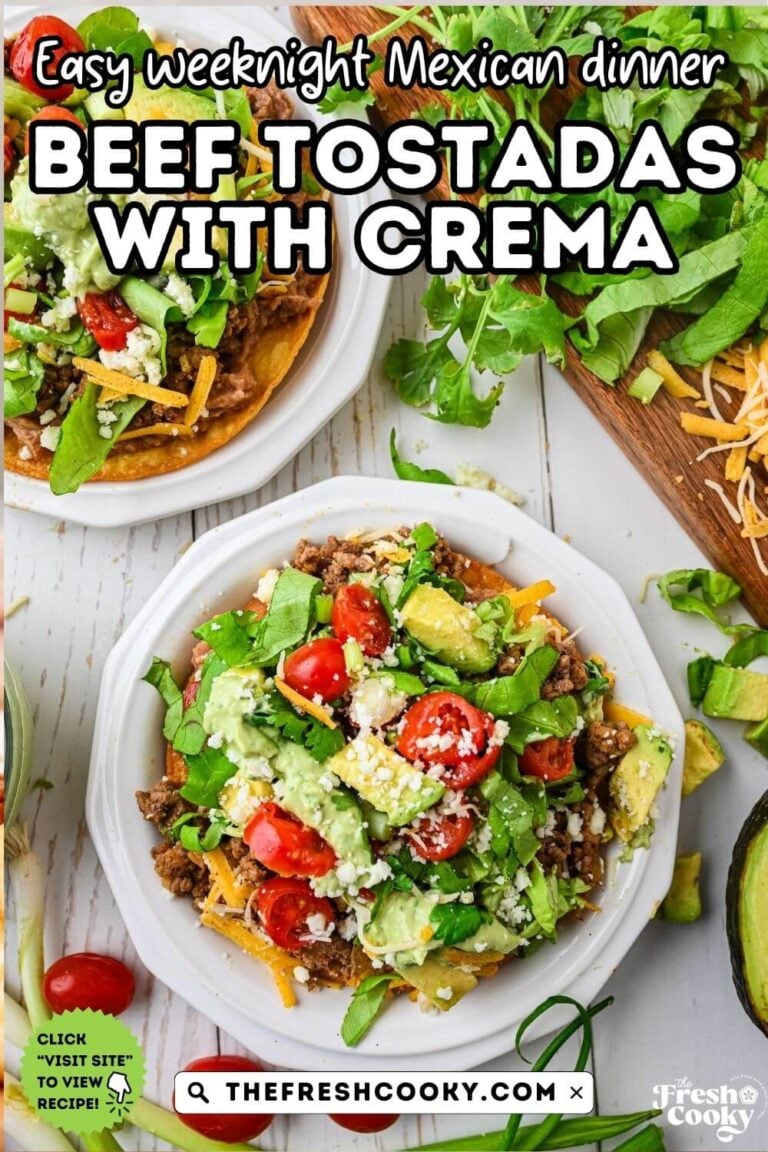 A couple of tostadas on plates piled high with toppings and drizzled with avocado lime crema. To pin.