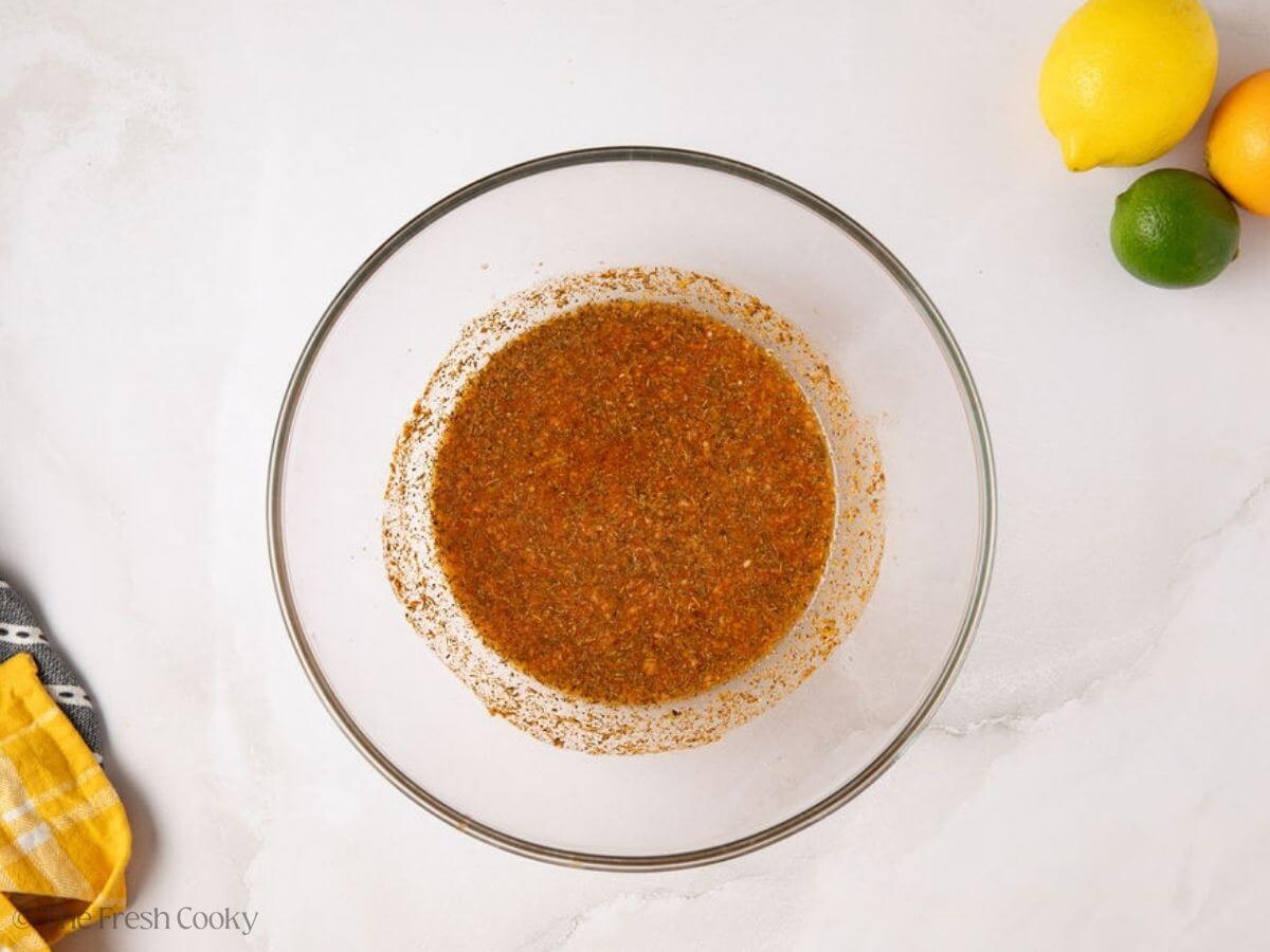 Pork tenderloin marinade in a mixing bowl.