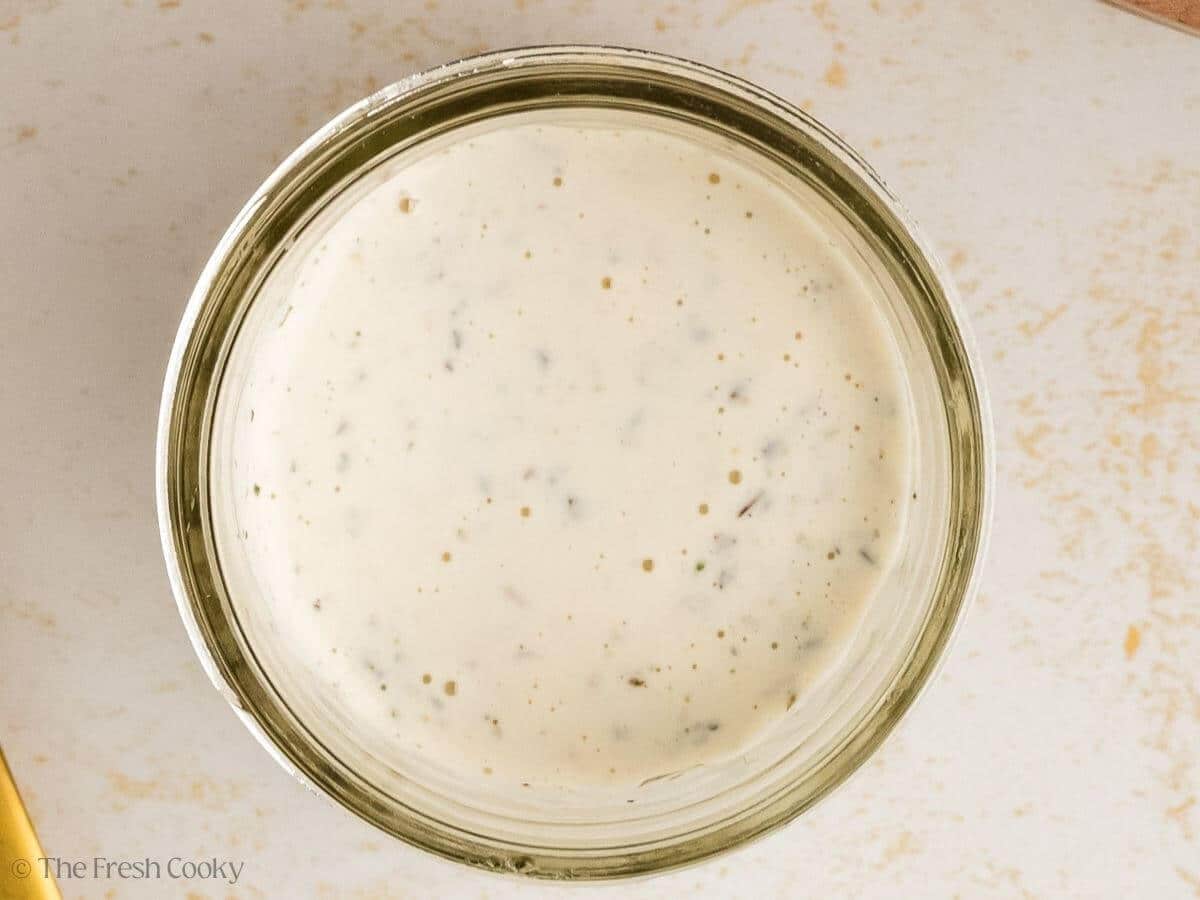 Dressing for the Italian grinder salad in a small bowl.
